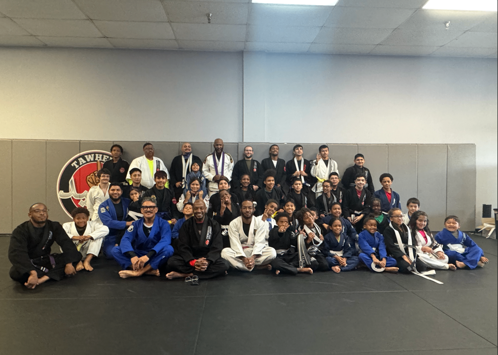 The Tawheed Jiu Jitsu team — coaches and students together on the mats